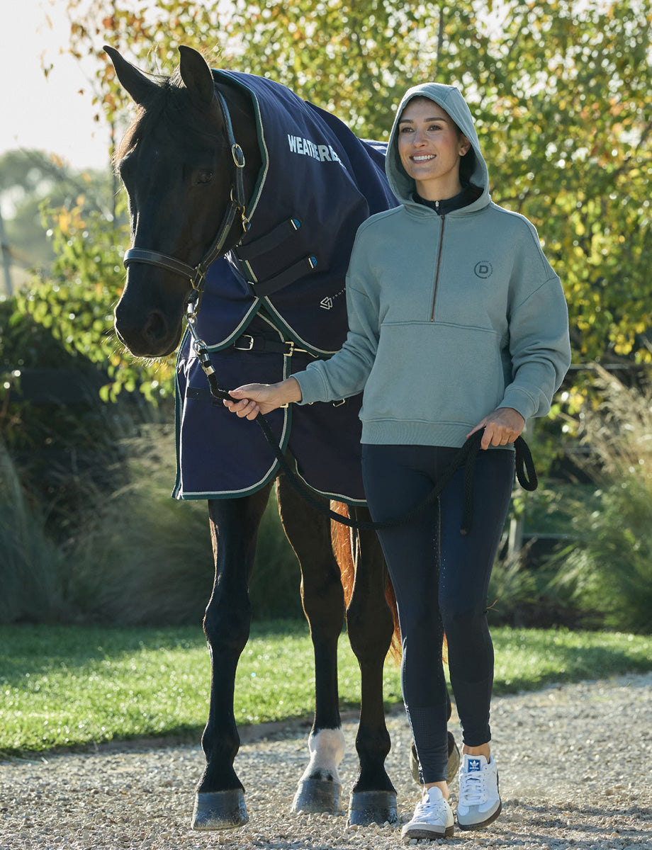1028854000-WASHEDTEAL_DB-Qtr-Zip-Hooded-Fleece-Pullover-Lifestyle2_Image_Null_Hero.jpg